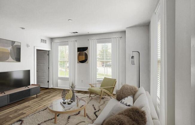 a living room with a couch and a tv at The Merchant Apartments, Charleston, SC, 29403
