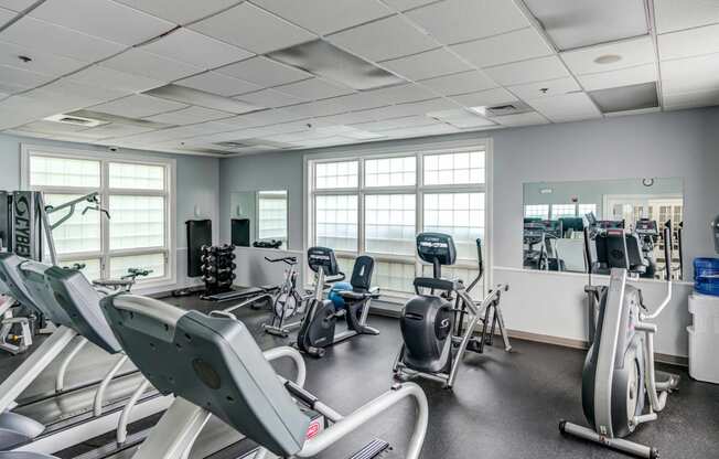 fitness center with cardio and weight equipment