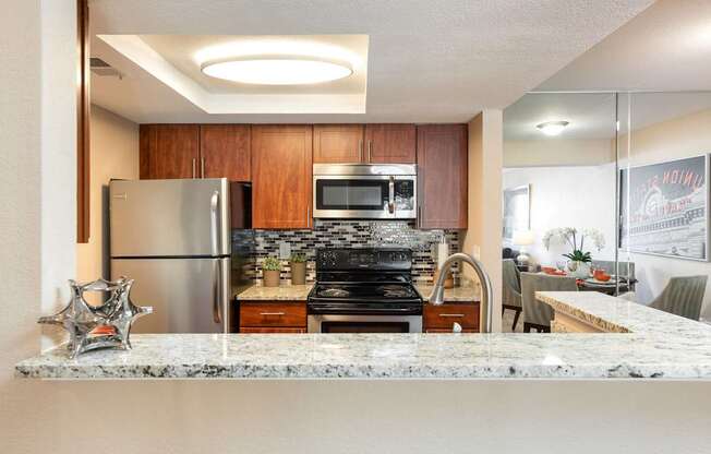 a kitchen with stainless steel appliances and granite counter tops