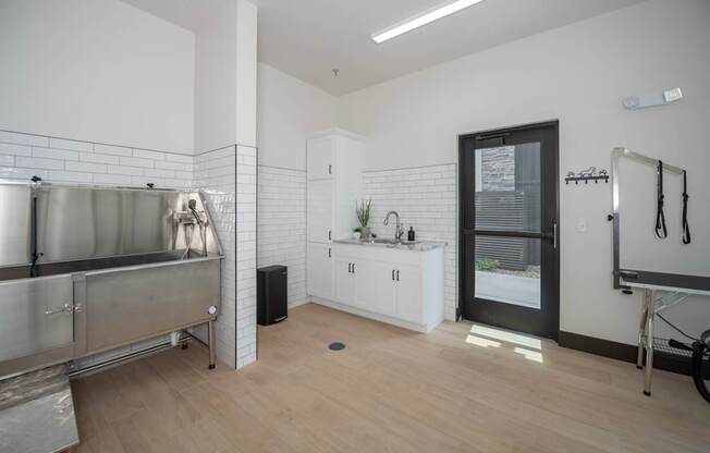 A kitchen area with a sink and a bicycle.