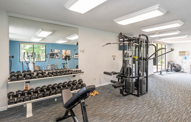 the fitness center has plenty of weights and cardio equipment at villas at park ridge