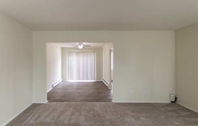 This is a photo of the dining room from the living room of the 1004 square foot, 2 bedroom/1 bath Townhome with stackable washer/dryer floor plan at Colonial Ridge Apartments in the Pleasant Ridge neighborhood of Cincinnati, OH.