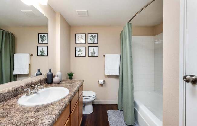the preserve at ballantyne commons apartment bathroom with tub sink and shower