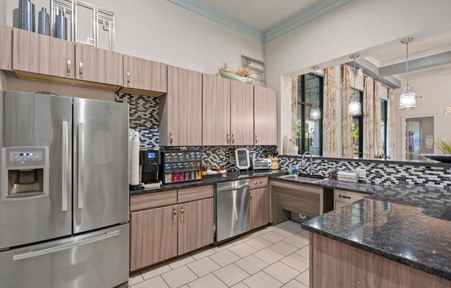 a kitchen with wooden cabinets and stainless steel appliances