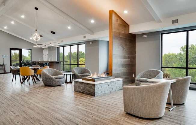 a living room with chairs and a fire pit. Circle Pines, MN Lexington Lofts