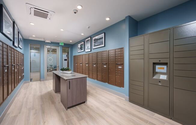 Aurora Apartments mailroom with parcel lockers
