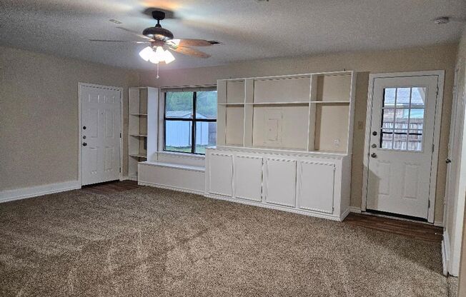 Three bedroom and two bathroom nicely remodeled with new flooring. Large wood fenced backyard