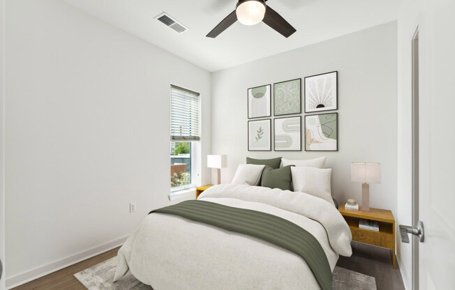 a bedroom with a large bed and a ceiling fan at The Box, Richmond, 23224