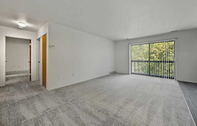 Open Living Room with natural light at Franklin River Apartments in Southfield, MIng Room with natural light at Franklin River Apartments in Southfield, MI
