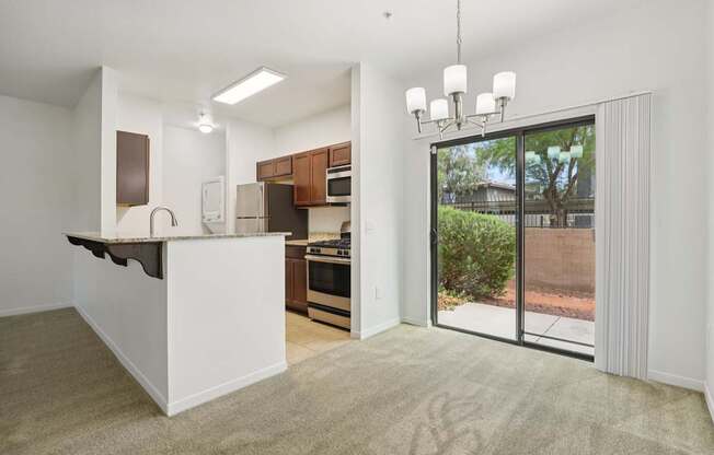 A kitchen with white cabinets and a white island with a countertop.