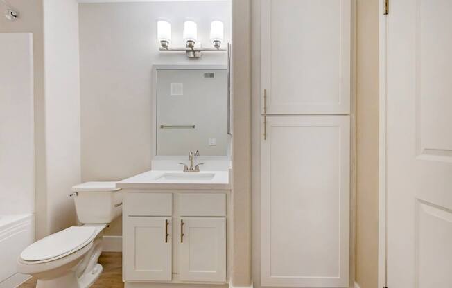 Each bathroom features sleek cabinetry, contemporary fixtures, and stunning tile work, creating a spa-like atmosphere.