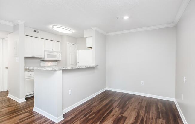 a kitchen with a wood floor