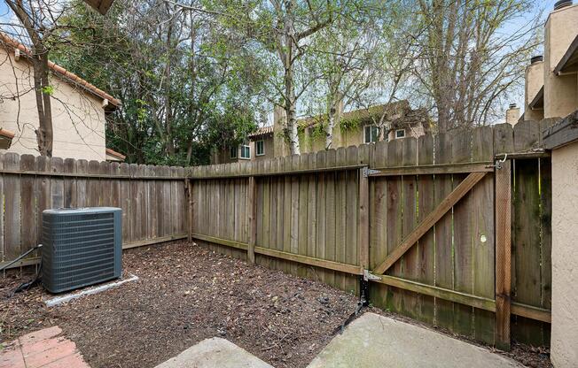 a house with a wooden fence