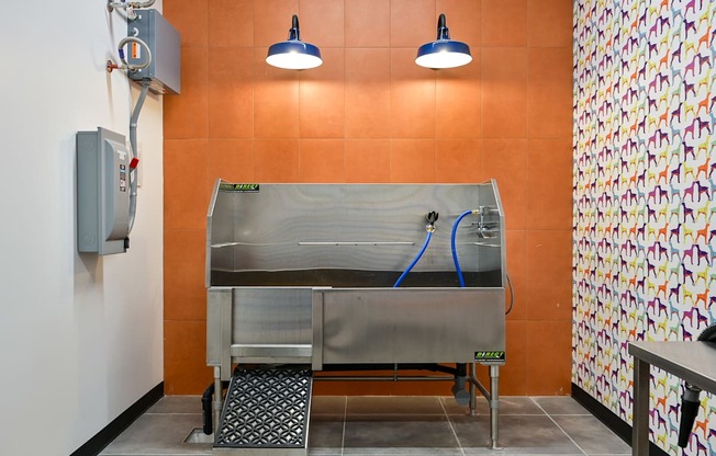 A wall-mounted oven with a stainless steel finish is installed in a kitchen.