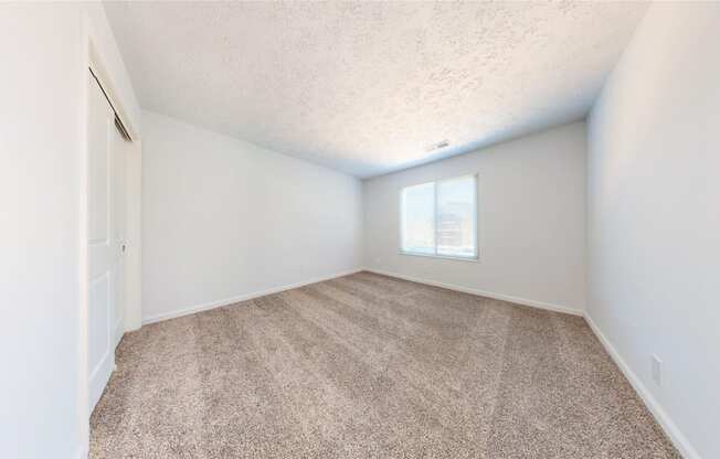 a bedroom with white walls and carpet at Lawrence Landing, Indianapolis, 46226