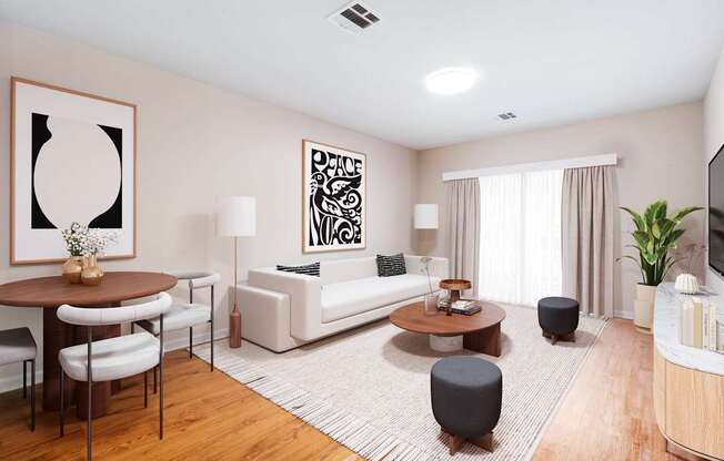 A living room with a white sofa, a coffee table, a TV, and a plant at Metro 303, Hempstead, NY, 11550