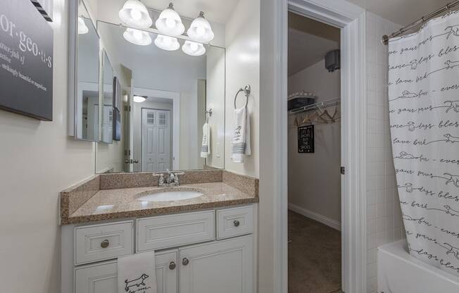 Bathroom and closet at Harpers Point Apartments, Cincinnati, OH