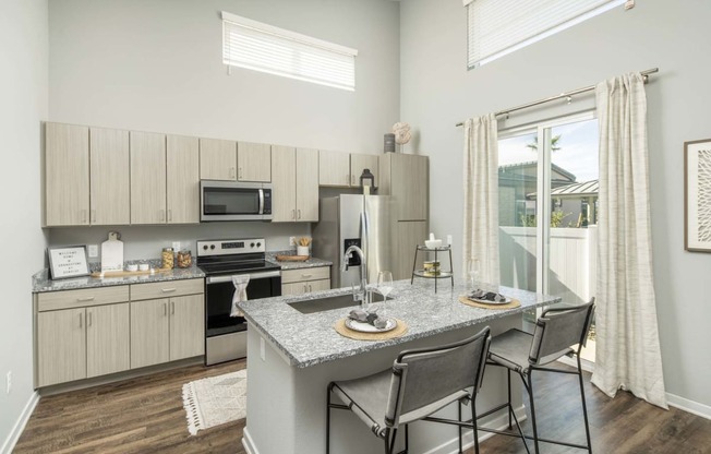 a kitchen with a marble counter top at Grandstone at Sunrise, Peoria, AZ