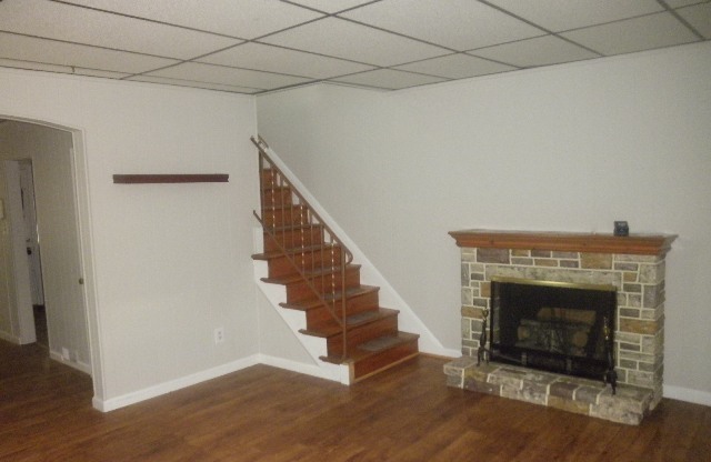 3 Bed, 1 Bath Townhouse with Fenced Yard, Hardwood Floors, and Fireplace