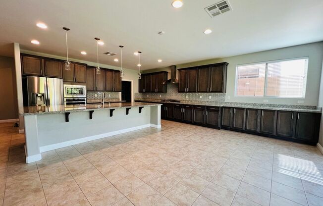 Stunning and spacious 4 Bed 3 bath 3,602 SQFT home inside Rhodes Ranch Guard Gated Golf Course Community!