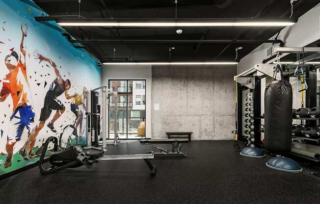 A gym with a mural of a man running.