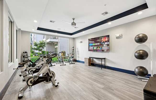 Professional-grade spin cycle studio with high-performance bikes at Harlow River Oaks apartments in Houston, TX.