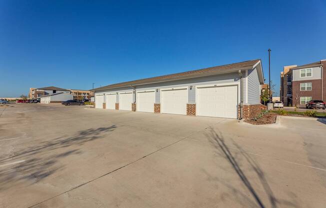 A large white garage door is the focal point of the image.