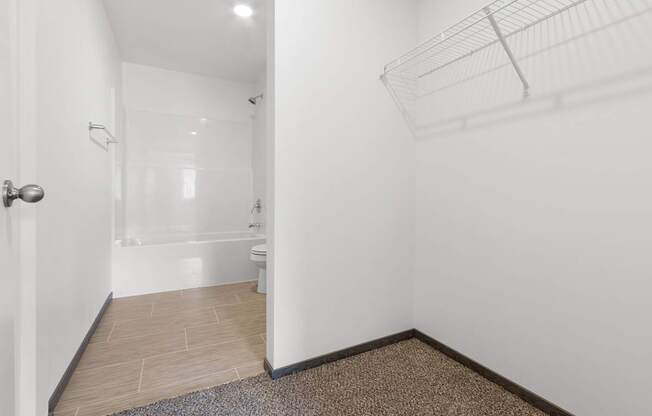 A bathroom with a toilet, sink, and shower.