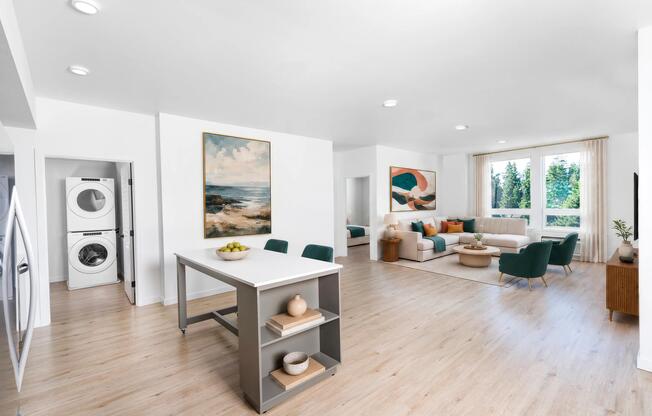 Open-concept floor plans feature versatile movable kitchen islands, expansive living areas, oversized windows, and the convenience of an in-home washer and dryer.