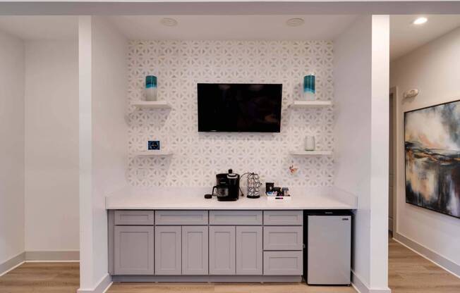 a kitchen with a counter and a tv on the wall at Enclave at Breckenridge Apartments, Louisville, 40220