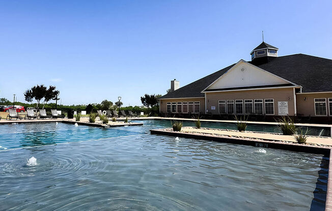 the pool is full of water in front of a building