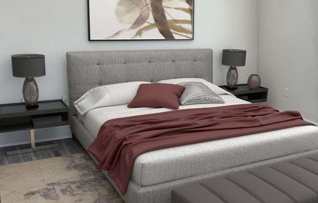 A bedroom with a large bed and a ceiling fan.