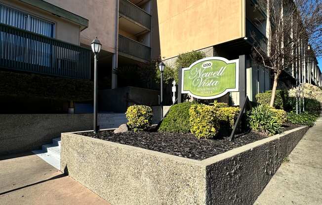 a building with a sign in front of a sidewalk