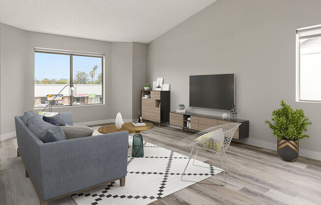 Hardwood floored living room with large windows.