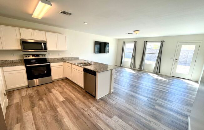 Modern 4 Bedroom Home with Granite Countertops & Vinyl Flooring!