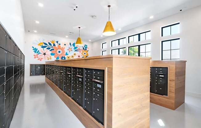 A long hallway with a black wall on the left and a wooden counter on the right.