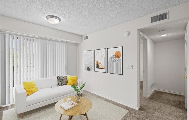 a living room with a couch and a coffee table