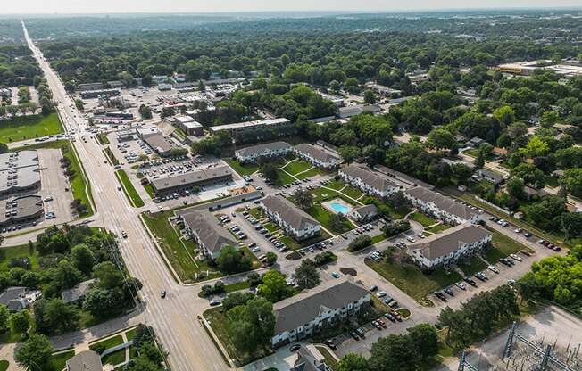 an aerial view of a city with many buildings and trees