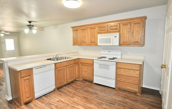 FOR LEASE! Nicely Remodeled 3 BR - 2 BA Brick Duplex With a 2 Car Garage in Weatherford