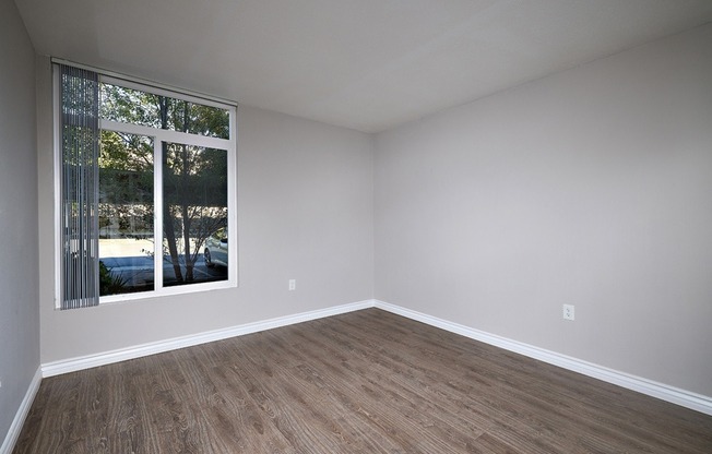 two bedroom bedroom with plank flooring
