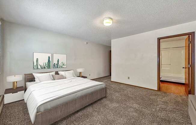 a bedroom with a bed and a door to a closet
