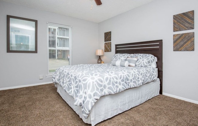 a bedroom with two beds and two windows