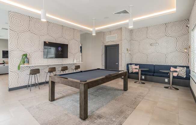 Pool Table With Adjacent Mounted Flat Screen