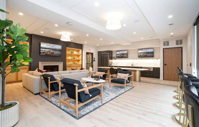 A living room with a fireplace and a large painting above it.