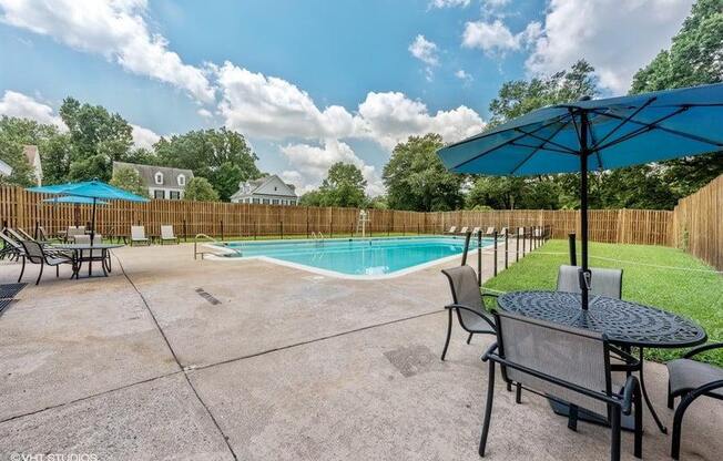 Outdoor Pool with Lounges and Tables