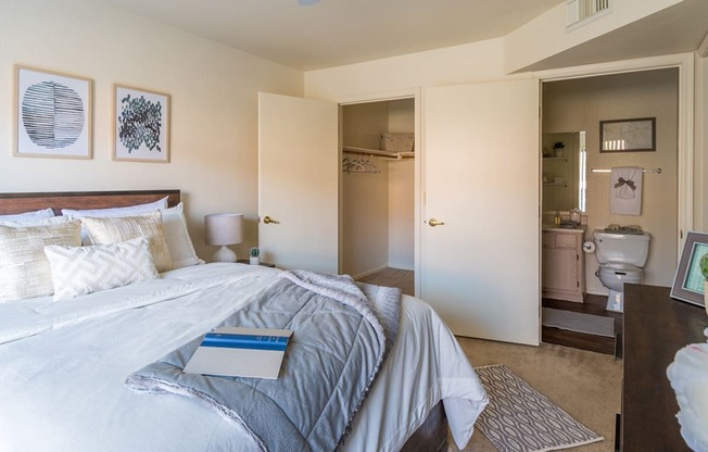 villas at Montebella bedroom with with nice natural lighting, carpet flooring and spacious closets