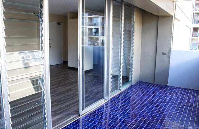 Waikiki Walina Apartments balcony with glass doors