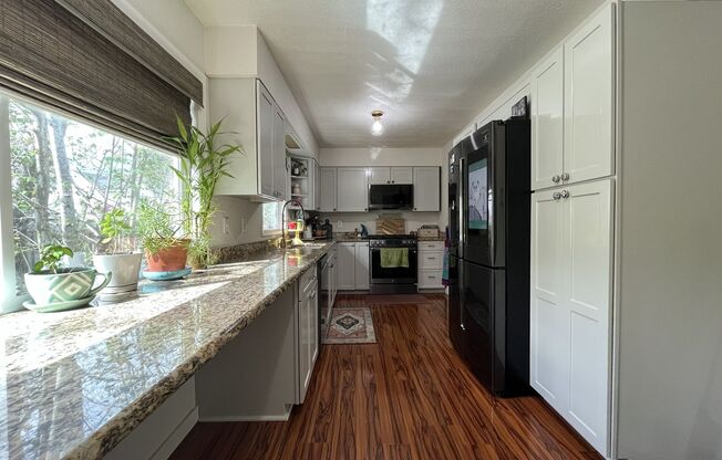 Comfortable Living in Bethany with Two Separate Units, Expansive 0.45-Acre Lot & Versatile Detached Shop