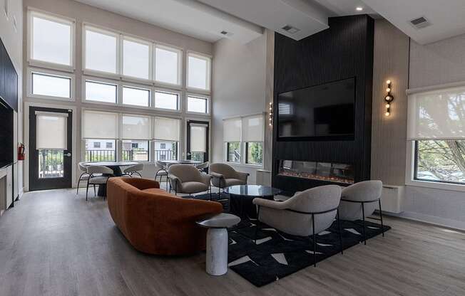 a large living room with a fireplace and a television