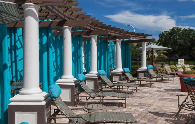 The Legends at ChampionsGate pool side pergola with lounge seating